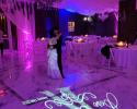 Monogram and purple uplighting 